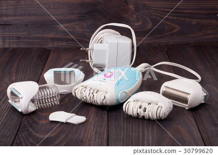 electro depilator on wooden table 30799620