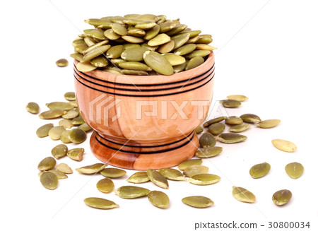 peeled pumpkin seeds in a bowl peeled pumpkin seeds in a bowl 30800034