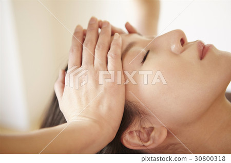 A photo of a facial massage. A photo of a facial massage. 30800318