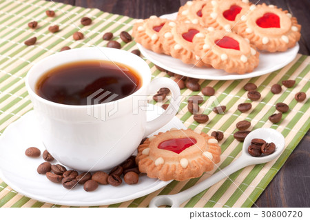 coffee cup with beans and cookies on the wooden 30800720