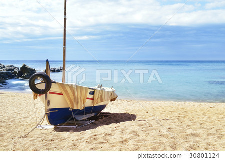 fishing boat beached in Lloret de Mar, Spain 30801124
