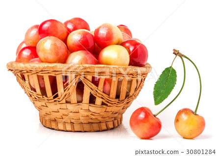 yellow cherries in a wicker basket isolated on 30801284