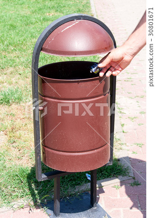 rubbish bin on the street a background of grass 30801671