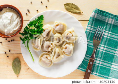 Plate with boiled dumplings Plate with boiled dumplings 30803430
