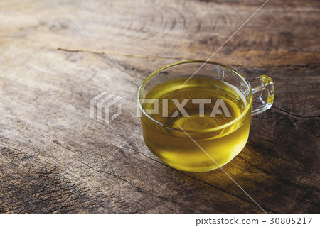 cup of chamomile tea with chamomile flowers 30805217