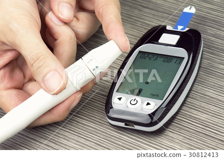 Close-up Of Woman Hands Testing High Blood Sugar. 30812413