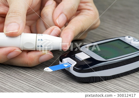 Close-up Of Woman Hands Testing High Blood Sugar. 30812417