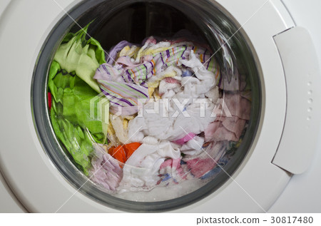Washing machine door with rotating garments inside 30817480