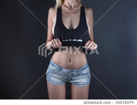 Young woman wearing shirt with sexual shape 30818074