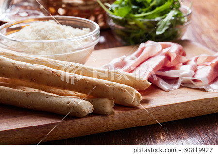 Italian grissini with ham prosciutto Italian grissini with ham prosciutto 30819927