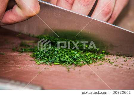 The chef in the kitchen prepares healthy food The chef in the kitchen prepares healthy food 30820661