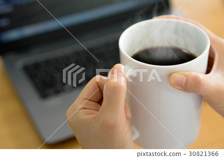 Businesswoman using tablet and drinking coffee Businesswoman using tablet and drinking coffee 30821366