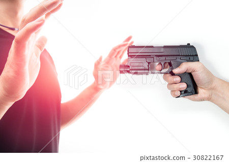 Robber with a gun intimidate a man surrender. Robber with a gun intimidate a man surrender. 30822167