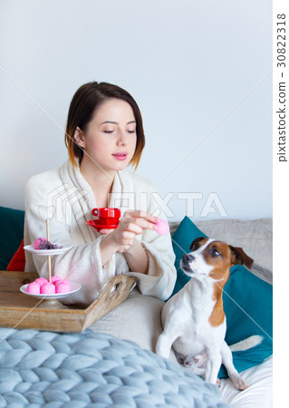 beautiful young woman holding her cup 30822318
