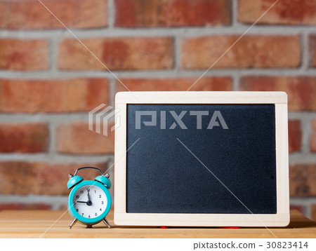 alarm clock and blackboard alarm clock and blackboard 30823414