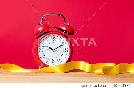 alarm clock and ribbon alarm clock and ribbon 30823575
