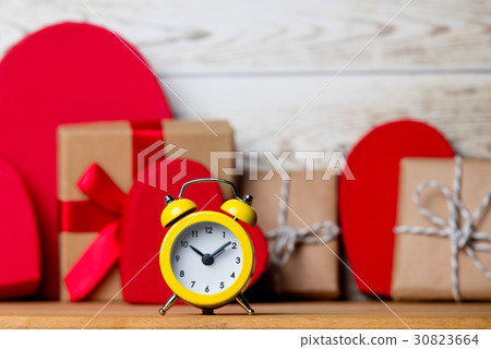 gifts, alarm clock and boxes 30823664