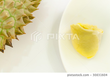 Durian on a white plate with green spike rind 30831604