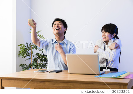 Cooler cool businessman and freezing business woman, laptop computer 30833261