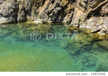 The stone under the pond, closeup as background. 30833590