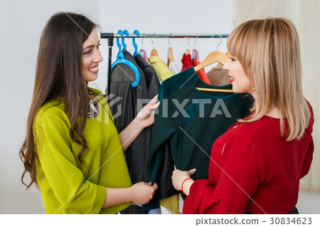 women deciding what to wear women deciding what to wear 30834623