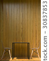 Chairs and tables in front of a wooden wall 30837853