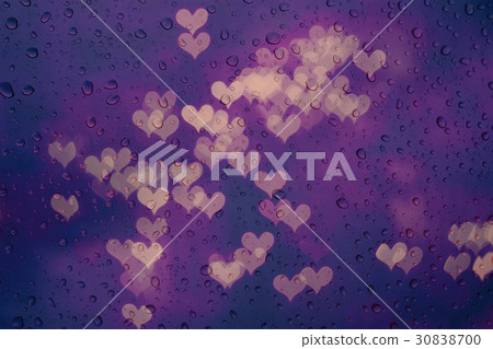 Rain water drops on glass with heart bokeh. Rain water drops on glass with heart bokeh. 30838700