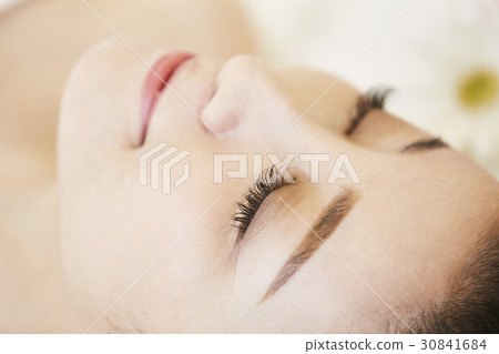 A woman with eyelash extensions A woman with eyelash extensions 30841684