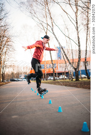 Roller skater legs in skates on asphalt walkway 30842070