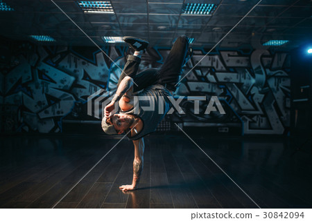 Breakdance performer posing in dance studio 30842094