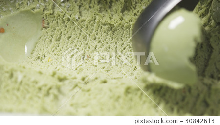 pistachio ice cream being scooped close up 30842613