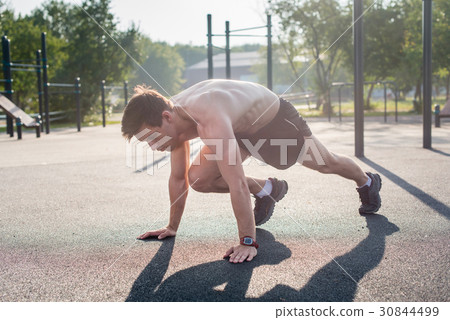 Young male athlete doing mountain climbing Young male athlete doing mountain climbing 30844499