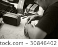 craftsman work with leather bag in film style 30846402