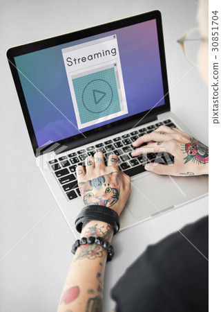 Hands working on laptop network graphic overlay 30851704