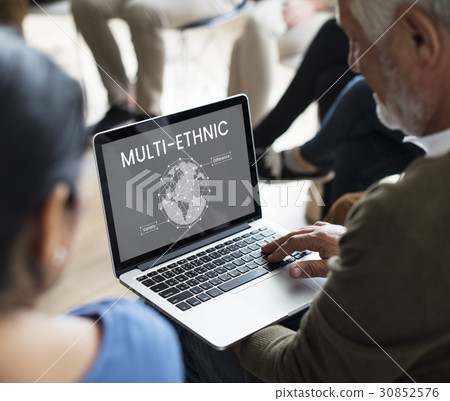 Workers working on laptop network graphic overlay 30852576