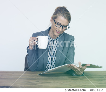 Office Worker Drinking Coffee Reading Book Office Worker Drinking Coffee Reading Book 30853434