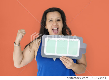 A powerful woman holding full charging battery 30853441