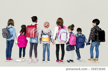 Rear view group of diverse kids standing in a row holdings hands 30853680