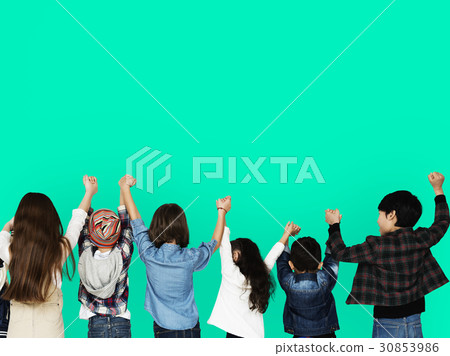 Group of children holding hand together in rear view Group of children holding hand together in rear view 30853986
