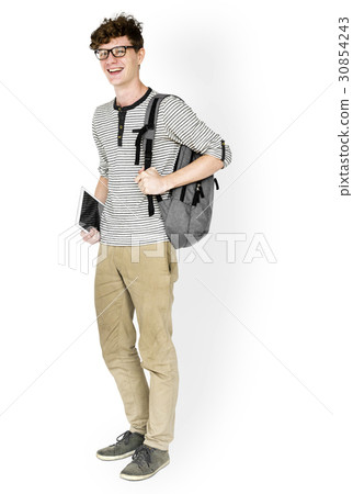Caucasian young man standing with backpack and tablet Caucasian young man standing with backpack and tablet 30854243