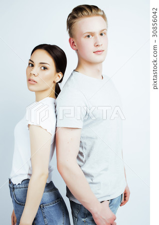 young pretty teenage couple, hipster guy with his 30856042