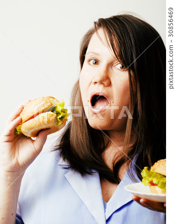 fat white woman having choice between hamburger 30856469