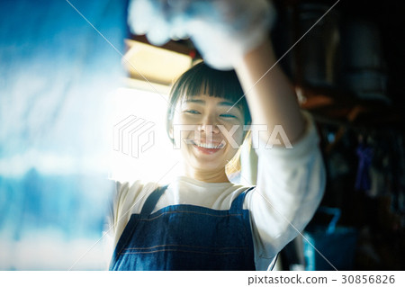 A woman watching a tie dye finish A woman watching a tie dye finish 30856826