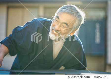 Indigo dye hand drying 30857030