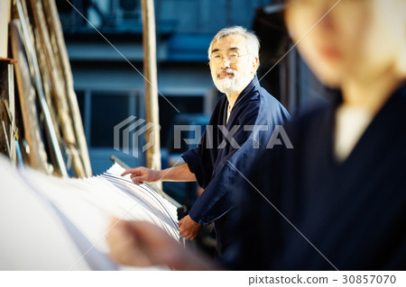 Indigo dye hand drying 30857070