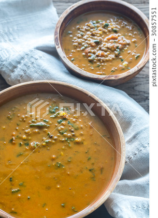 Two bowls of lentil curry 30857551