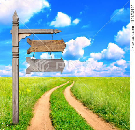 Landscape with dirt road and old wooden signboard Landscape with dirt road and old wooden signboard 30858495
