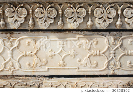 Ancient carved flower on marble in Taj Mahal India Ancient carved flower on marble in Taj Mahal India 30858502