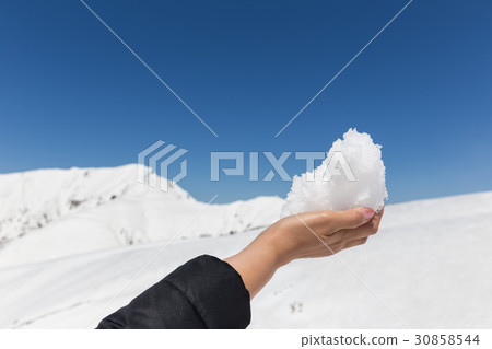 snow on woman hand 30858544