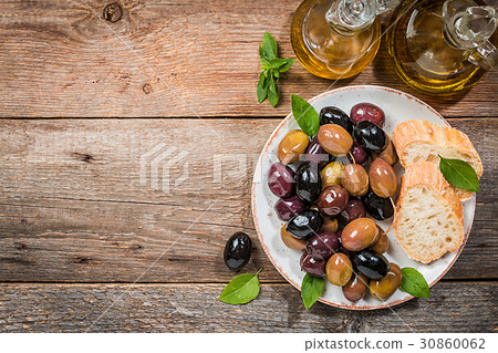 Olive oil, different olive fruites and fresh bread Olive oil, different olive fruites and fresh bread 30860062